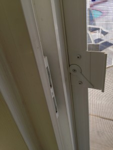 inside handle of white sliding screen doors installed in Simi Valley
